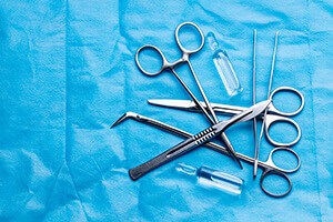 Stack of surgical equipment at surgery desk